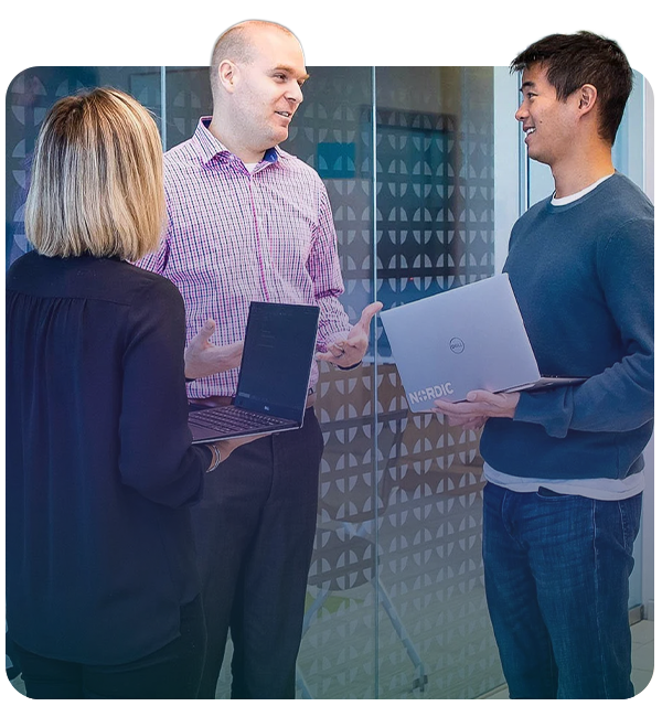 3 workers talking and smiling