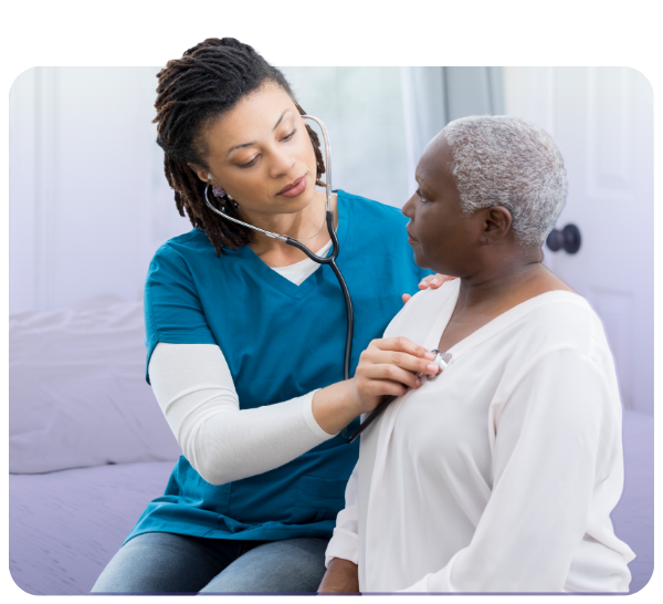Female clinician using stethoscope on female patient