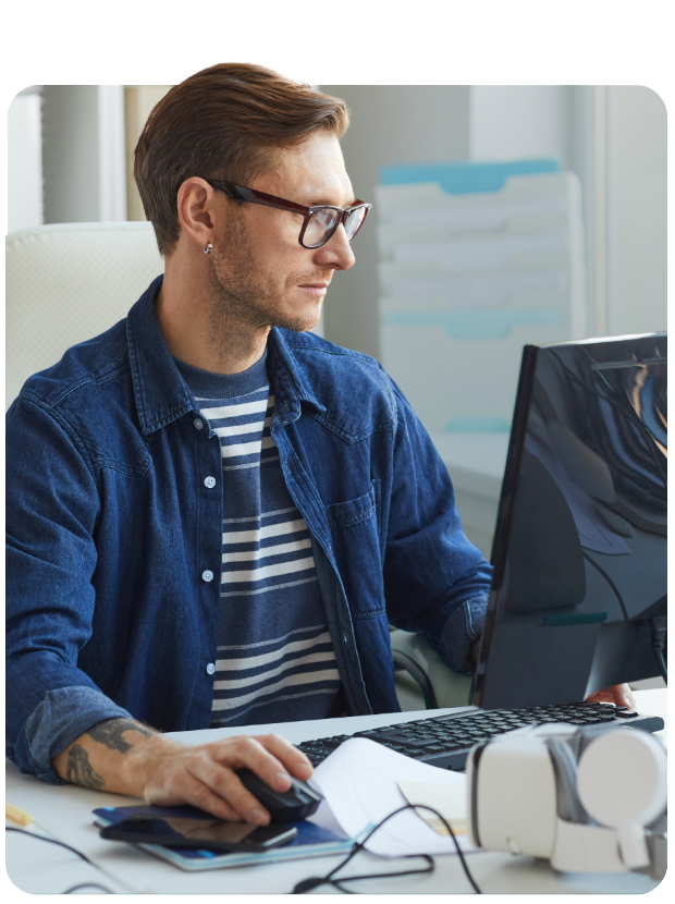 Man using mouse to work on a desktop