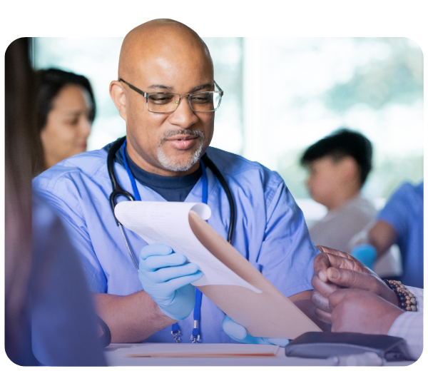 Clinicians reviewing information on clipboard