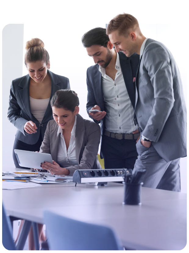Four business associates huddled over tablet