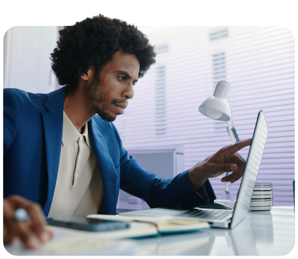 Male reviewing information on laptop