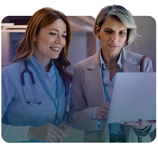 Doctor and admin looking at laptop