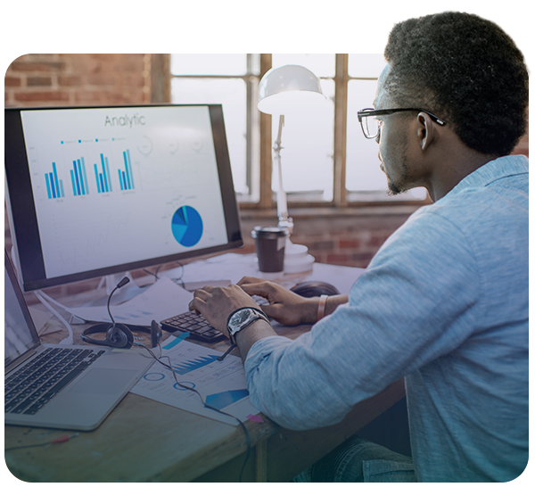man working on computer viewing stats