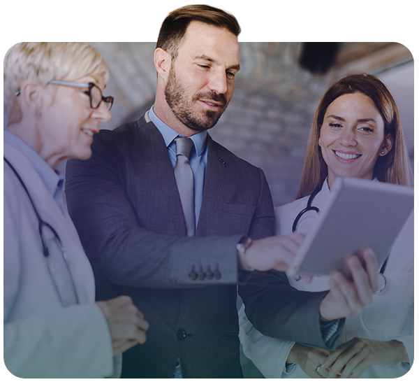 Doctors and business professional reviewing tabler