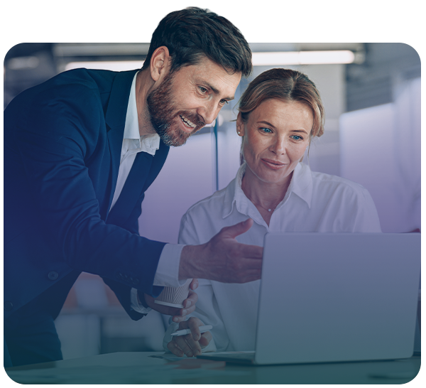 Two professionals reviewing information on laptop