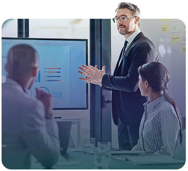 Business meeting reviewing analytics and stats