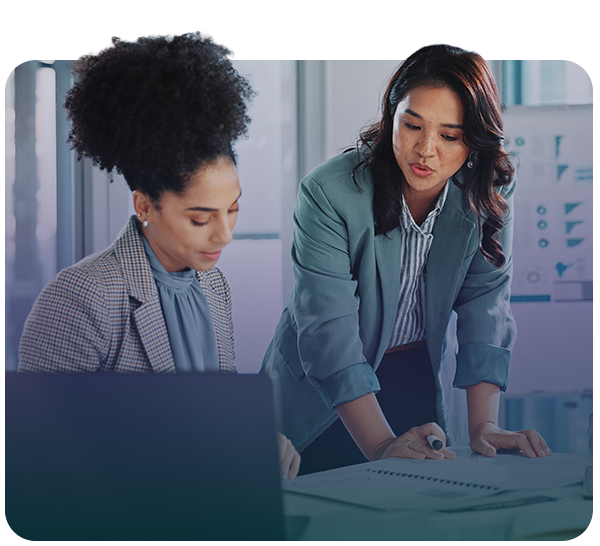 Two women looking at a report