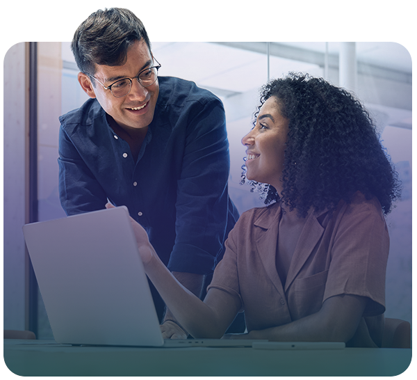 Two people having a discussion with a laptop in front of them