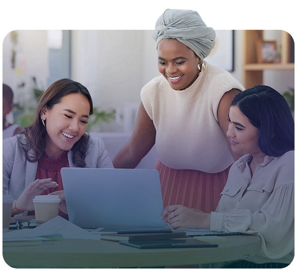 Three women looking at laptop