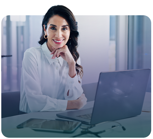Professional woman smiling with laptop in front of her
