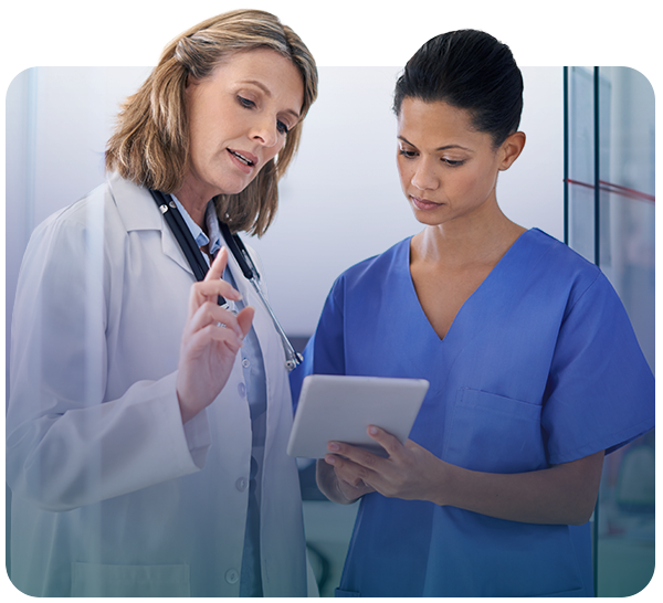 Two female clinicians looking at tablet