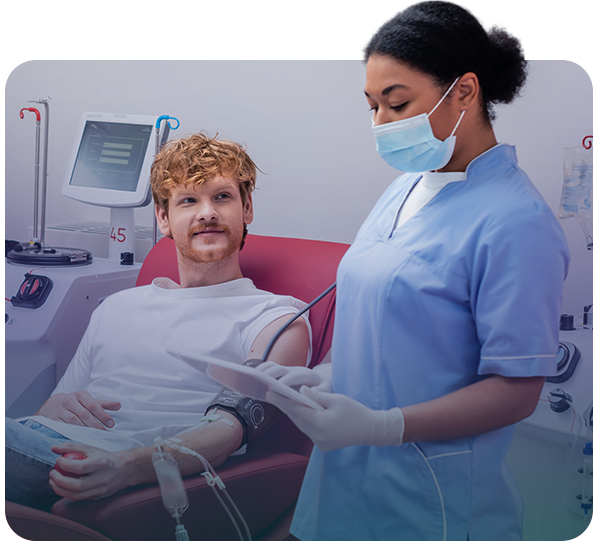 Female clinician using tablet in infusion room