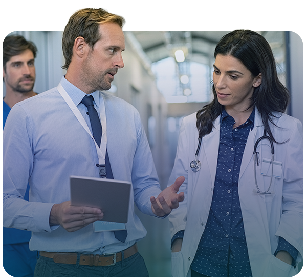 Administrative personel talking with doctor