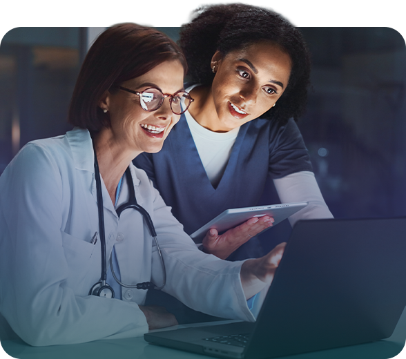 medical professionals reviewing information on computer and tablet