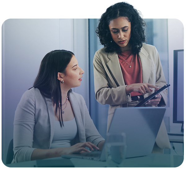 Businesswomen reviewing analytics